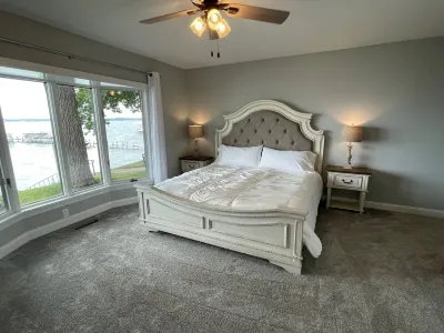 Enjoy this beach front lake home that boasts 66' of frontage with many amenities
