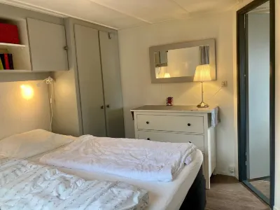 Chalet Gaby with Sauna, Private Dock, and Canoes at Lauwersmeer Hotels in 