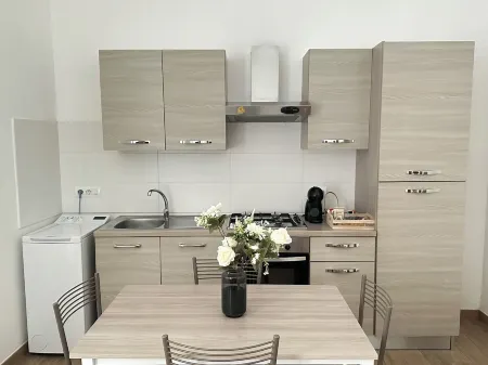 TOI Apartments Отели рядом с достопримечательностью «Colonne Terminali della Via Appia»