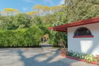 Private suite 102 with beautiful gardens, shared pool and BBQ area!