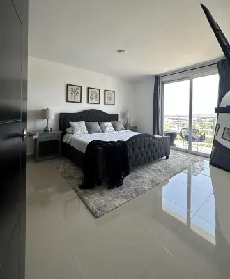 New modern 2 bed 2 bath condo steps away from the beach with rooftop pool deck!