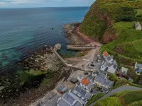 Cosy fisherman's cottage on the Pennan seafront.