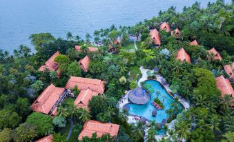 aerial view of a resort surrounded by water , with several buildings and a swimming pool in the center at Anantara Hua Hin Resort