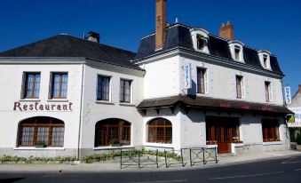 "a white building with a sign that reads "" le restaurant "" is shown in the image" at Logis Hôtel Saint-Hubert