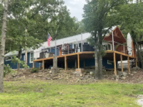 SHORT WALK TO WATER & NESTLED IN THE TREES THIS BEAUTIFUL CABIN HAS LAKE VIEWS