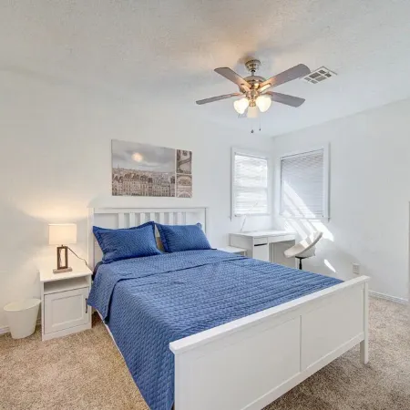 King bed with Pool table, decked patio and, gym.