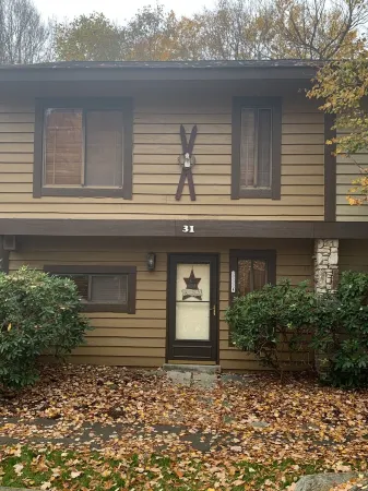 Get cozy for the winter in this 3 floor, 4 bedroom rustic ski home