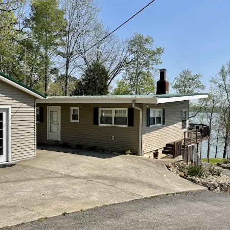 Experience Kentucky Lake out the back door! Spacious 4-bedroom retreat awaits.