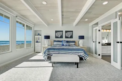 Gorgeous waterfront home with a private hot tub, gas fireplace, & beach access