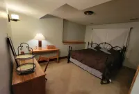 Charming 2-bedroom apartment with outdoor hot tub in rural area, private yard.