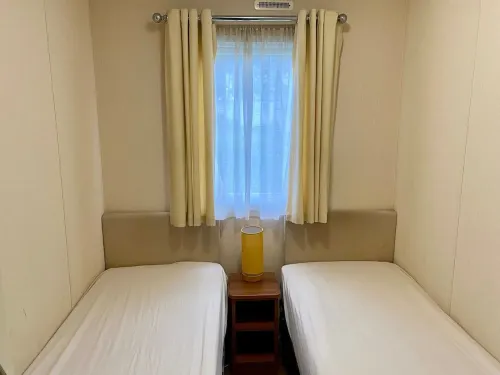 Lotus 2 bedroom dog friendly caravan with veranda offers a stunning sea view.