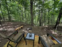 Charming A-frame cabin set in the woods overlooking deep wooded ravines.