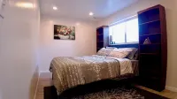 3-bed/2 bath basement apt. in charming Midvale with AC, wifi, laundry & hot tub.