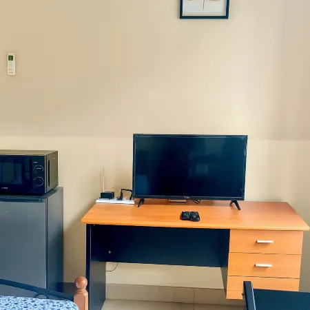 Cozy Guest Room in Kinshasa with Balcony and Partial Air-Conditioning