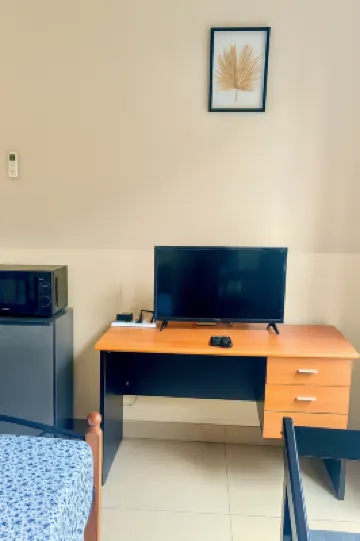 Cozy Guest Room in Kinshasa with Balcony and Partial Air-Conditioning