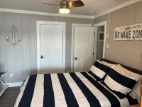 Experience Lake Life at Our 3-Bedroom Beachfront Cottage, Near Grand Rapids.