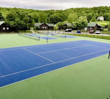 Nestled by the 7th green, large deck areas. Movie theatre for inside or out.