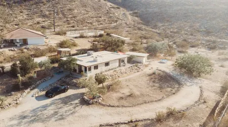 On1.5 acres & surrounded by lots of unbuilt land. Minutes to Joshua Tree & Shops