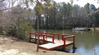 The Lake House at Turtle Cove: Cozy relaxing lake home with dock on wooded lot.