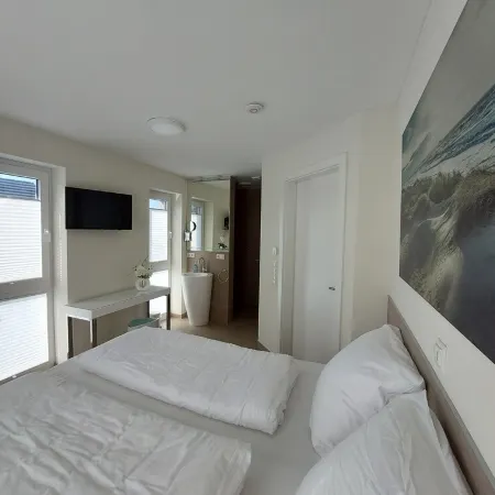 NEW! modern, high-quality, central apartment, with sauna, garden, wallbox in Burhave
