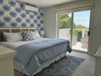 Modern coastal retreat w/ pool,  close to beaches and golf courses.