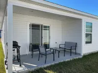 Spacious Kitchen and Cozy Patio - Charming Modern Getaway