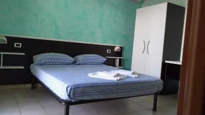 Room in BB - Quadruple Room a Stones Throw from the Sea - Ideal for a Relaxing Holiday Hotels in Roseto degli Abruzzi