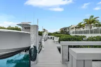 Sophisticated 5-bedroom, elevator, 50' dock, heated pool/spa, sleep 12