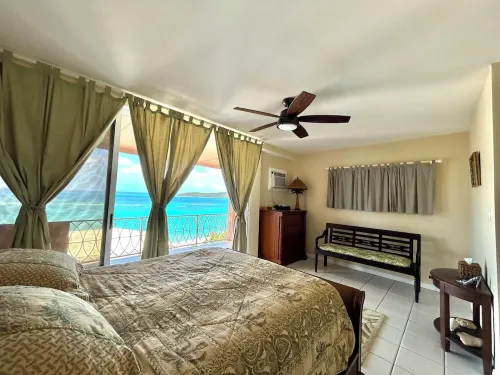Caribbean Breeze Condo - hilltop breezes, views, convenience to beach & more!
