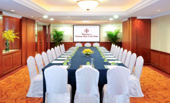 a large event room with long tables and chairs arranged facing the front at Harbour Plaza North Point