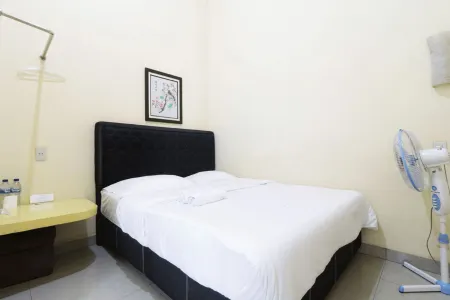 Krisna Hostel Отели в г. Percut Sei Tuan
