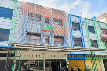 JOY GuestHouse Pekanbaru Mitra RedDoorz Отели в г. Labuh Baru Barat