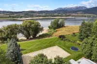 Stunning Lakefront Retreat with Jacuzzi and Unobstructed Mountain Views