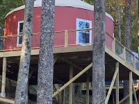 Elevated eclectic yurt with wrap-around porch, hot tub, and mountain view! Hotels in Piper Gap