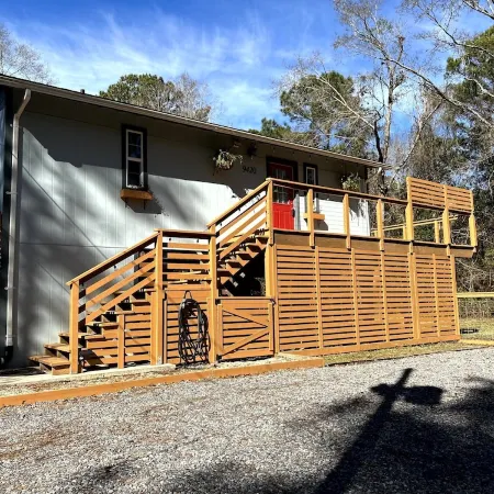Cozy coastal oasis w/ wooded views and wrap around deck. Close to Dauphin Island