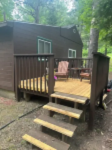 A Stream  runs through it. Comfy little cabin with a stream by your bedroom.