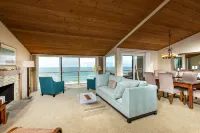 Expansive Oceanfront Patio and Resort-Style Amenities - Charming Coastal Haven