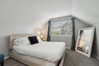 Updated Lansing Home | 4BR w Basement Theater Room