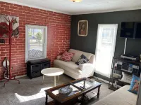Updated bungalow with screened in porch  in rear.