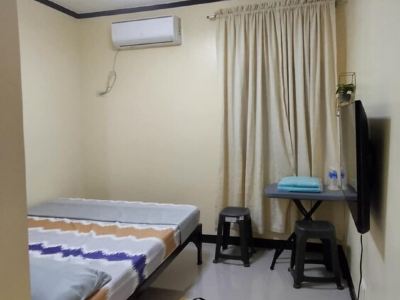Cozy 2-bedroom lodge with WiFi, AC in charming Bagac