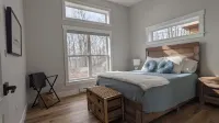 Unwind at BasinView Retreat: Luxe Waterfront Cottage with hot tub & beach access