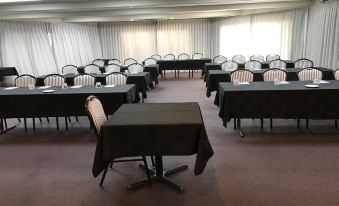 a large conference room with multiple rows of tables and chairs arranged for a meeting or event at Castaways Resort