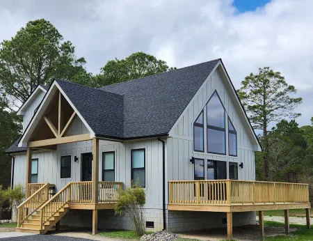 Secluded waterfront getaway with hot tub,fire pit, and private dock.