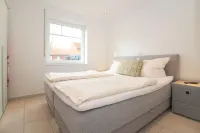 Bright, modern ground floor apartment for 4 people including four-legged friends Hotels near Norden Altstadt