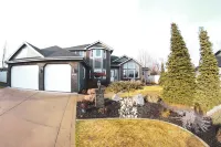 Gorgeous 6-bedroom home with theater, spa and gym, and more, on parklike grounds