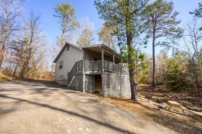 New Listing! Couples retreat- swing bed-hot tub-fire pit-putt putt Hotels near Tennessee Legend Distillery - Winfield Dunn Parkway