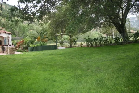 Center model of lux triplex with kaweah river running by property.