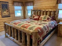 Log home nestled in tall pines near Norway Lake