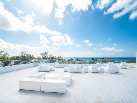 7 Mile Beach private Beach Club, ocean views from Roof deck and Pool Pavilion