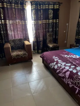 Lovely 2-Bedroom Cozy Apartment in secured GRA Отели в г. Шагаму